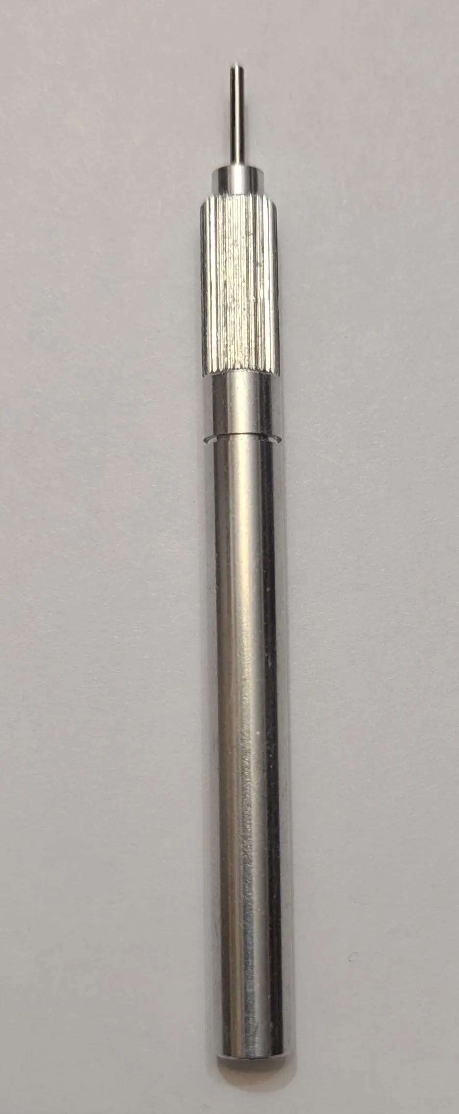 close-up of professional metal quilling tool with 1.3 mm medium tip and ergonomic grip