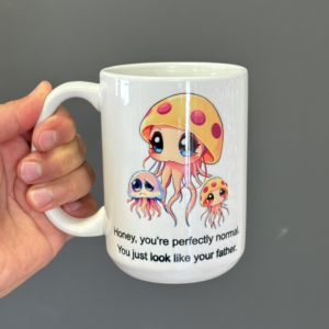 Funny jellyfish mug with cartoon jellyfish family and quote “You’re perfectly normal. You just look like your father"