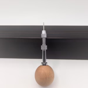 1.3 mm swivel head quilling needle with standard or guided tip. Ergonomic ball handle, vise pin system, and tabletop holder for precision and comfort.