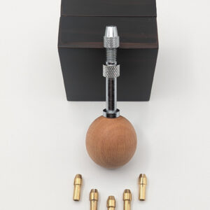Swivel-headed ball handle for interchangeable quilling needles, shown with five metal housings arranged in a row.