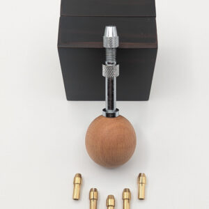 Swivel-headed ball handle for interchangeable quilling needles, shown with five metal housings arranged in a row.